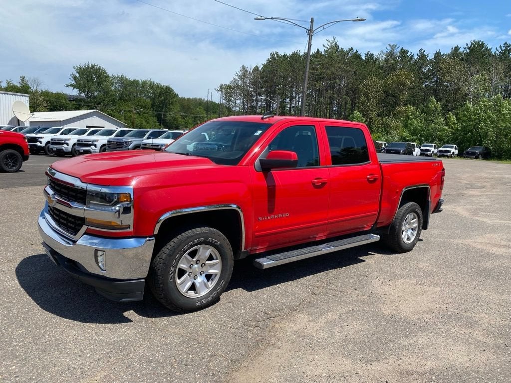 2018 Chevrolet Silverado 1500 LT in Red Hot — front three-quarter view